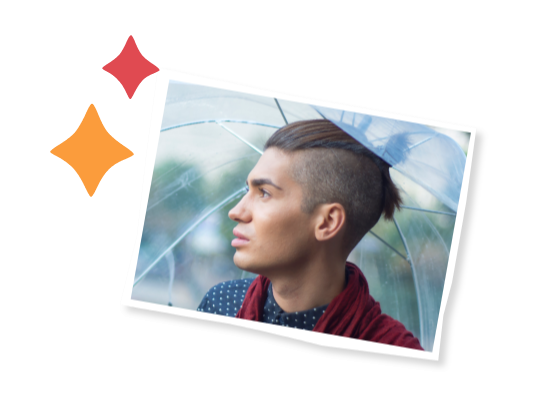 A young person outside with an umbrella